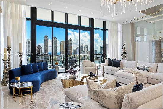 Step into extraordinary luxury with this two-story corner penthouse at Prive, a prestigiou