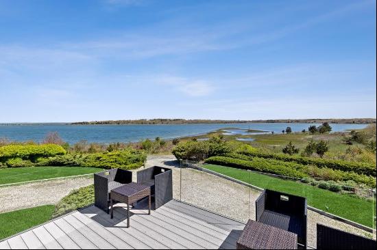 A rare opportunity to own a stunning waterfront retreat with breathtaking views, a heated 