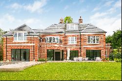 Expansive family home with private swimming pool for rent in Oxshott