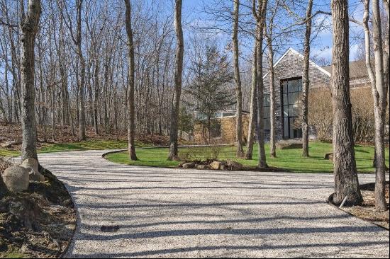 Set on 3.5+/- pristine, centrally located acres of private grounds, this beautifully re-im