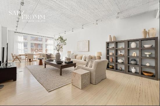 Welcome to a truly exceptional loft in the heart of Tribeca, where historic charm meets