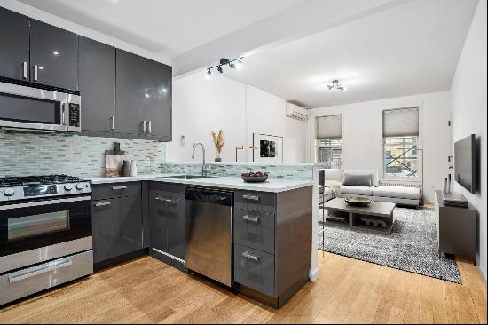 This newly renovated 2-bedroom, 1.5-bath apartment in the heart of Lenox Hill offers a 