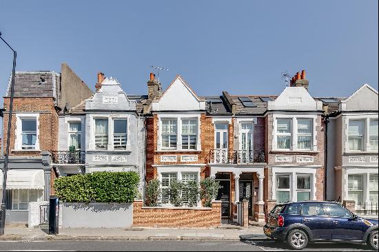 A five bedroom family home with garden on Munster Road, SW6.