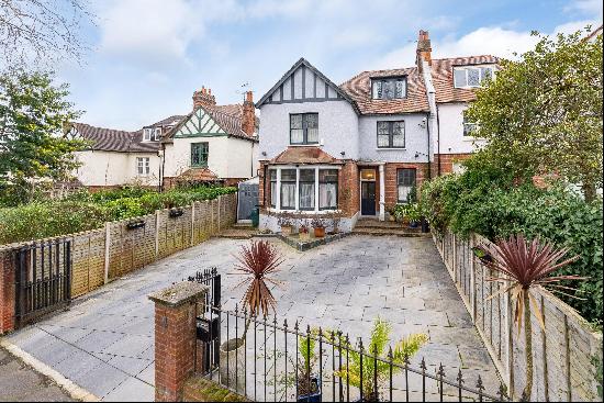 A wonderful 5 bedroom home with off-street parking and a large South-West facing garden.