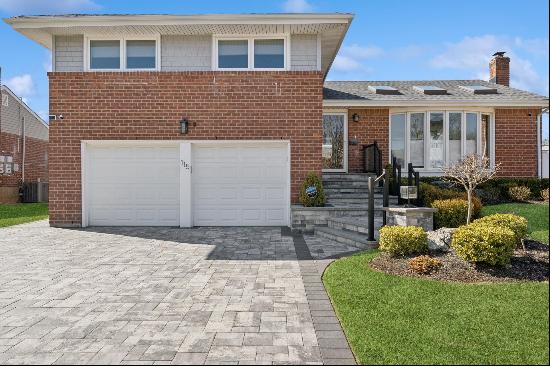 Welcome to this stunning 4-bedroom, 3 full bath split-level residence that seamlessly blen