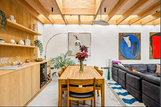 A truly remarkable end of terrace house with a striking design and south-east facing garde