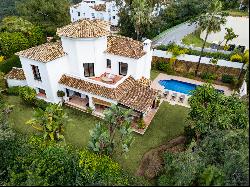 Charming Mediterranean Andalusian style villa in frontline golf