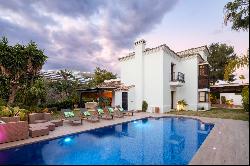 Charming Mediterranean Andalusian style villa in frontline golf