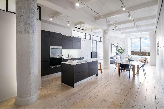 <p>Located in the heart of Greenwich Village, this spacious two-bedroom, two-bathroom loft