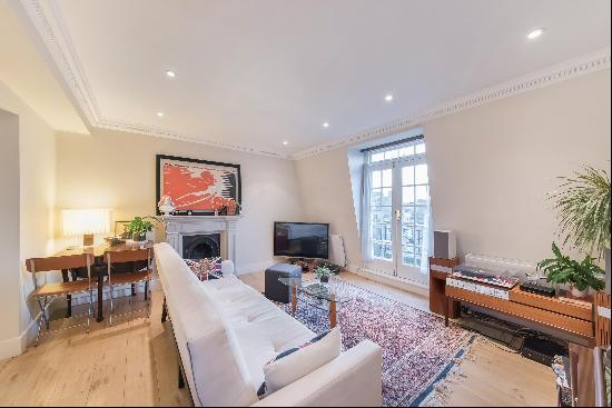 A beautifully presented top-floor apartment with a lift in a classic South Kensington peri