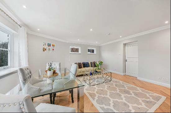 A newly refurbished top floor apartment is set within a prestigious period conversion in t