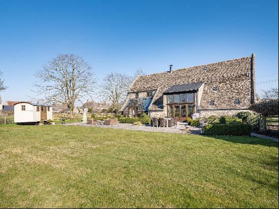 A period Cotswold stone barn that has been modernised to a high standard and sits perfectl