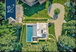 Period estate with a pool, spa and olive grove for sale on Chianti's hills