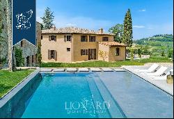 Period estate with a pool, spa and olive grove for sale on Chianti's hills