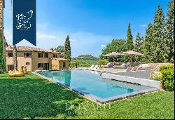 Period estate with a pool, spa and olive grove for sale on Chianti's hills