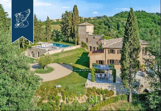 Period estate with a pool, spa and olive grove for sale on Chianti's hills