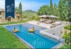 Period estate with a pool, spa and olive grove for sale on Chianti's hills