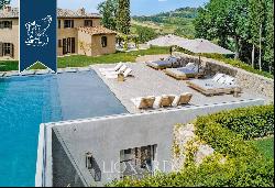 Period estate with a pool, spa and olive grove for sale on Chianti's hills